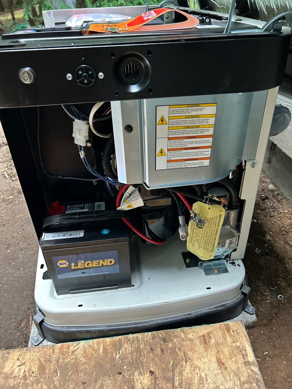 Melby Electric showcases a generator with open panel for inspection and maintenance